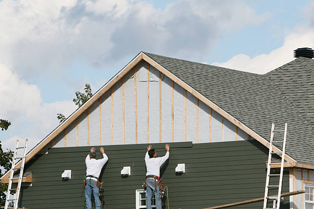 Professional Storm Damage Siding Repair technician working in Fannettsburg, PA